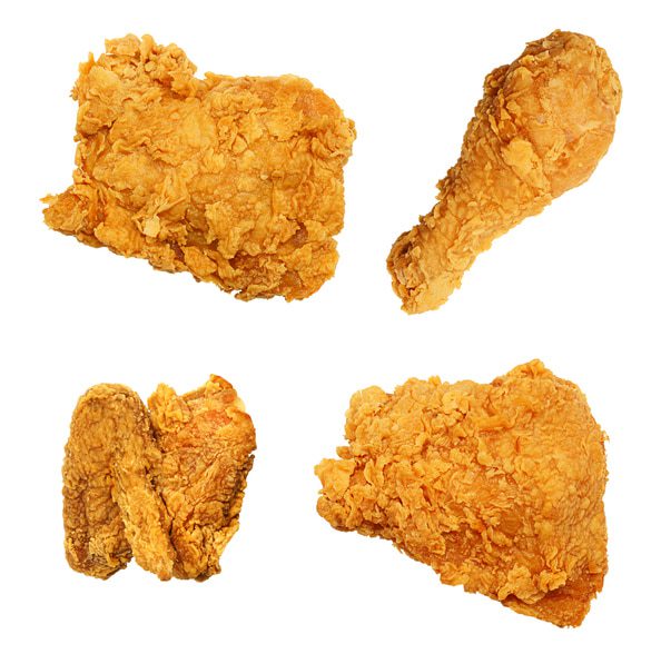 Four Broasted Chicken Pieces on a white background
