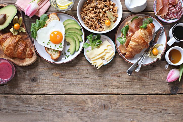 breakfast foods on a wooden table.